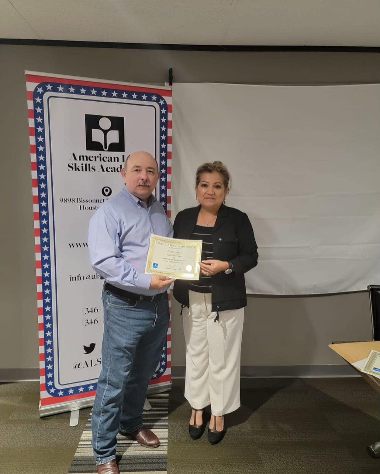 Edwardo Rodriguez presenting a certificate of completion at the academy